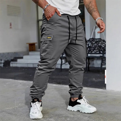 👖50% KORTING🏃 Werkkleding-joggingbroek | Trekkoord in de taille · Duurzaam polyester · Taps toelopende pijpen · Meerdere zakken