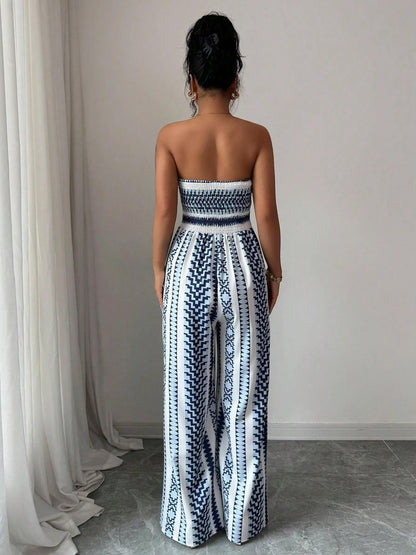 🌀 BE PERSTIJN 50% KORTING! 💥 Geometrisch jumpsuit met halterhals en split – Unieke print, elegante pasvorm, veelzijdige stijl ✨