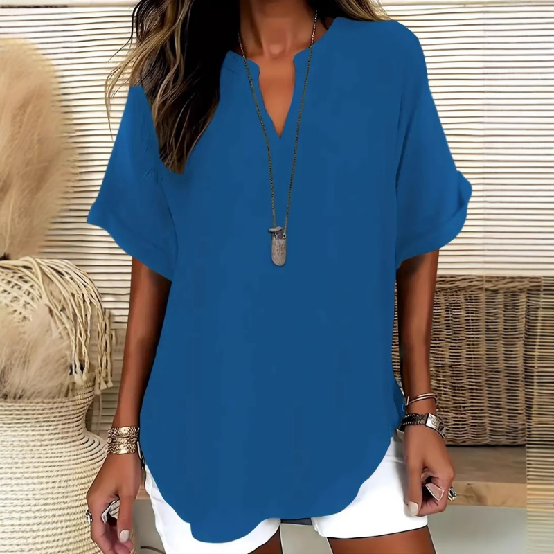 👚60% KORTING! 🔥Modieuze losse top met korte mouwen – V-hals met inkeping, asymmetrische zoom en lichtgewicht stof (5 kleuren, S–2XL) 🌸