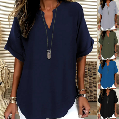 👚60% KORTING! 🔥Modieuze losse top met korte mouwen – V-hals met inkeping, asymmetrische zoom en lichtgewicht stof (5 kleuren, S–2XL) 🌸