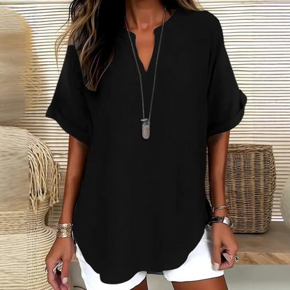 👚60% KORTING! 🔥Modieuze losse top met korte mouwen – V-hals met inkeping, asymmetrische zoom en lichtgewicht stof (5 kleuren, S–2XL) 🌸