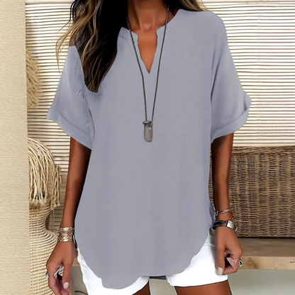 👚60% KORTING! 🔥Modieuze losse top met korte mouwen – V-hals met inkeping, asymmetrische zoom en lichtgewicht stof (5 kleuren, S–2XL) 🌸