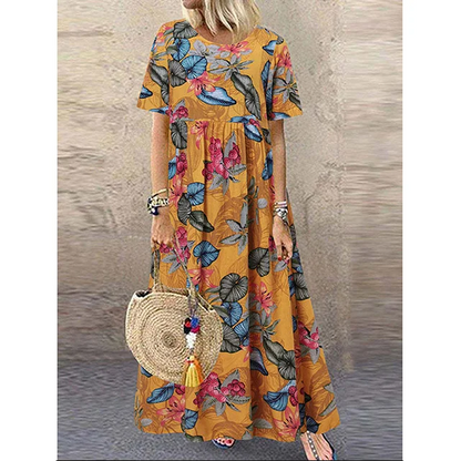 Retro maxi-jurk met bloemenprint 🌼 Ronde hals, korte mouwen, losvallend en zwierig, waardoor je eruitziet alsof je zo uit een tuin bent gestapt 🌿